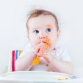 Baby eating carrot Royalty Free Stock Photo