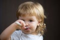 Baby eating with dirty face. Cheerful smiling child child eats itself with a spoon Baby eating with dirty face. Smiling Royalty Free Stock Photo