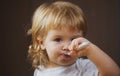 Baby eating with dirty face. Cheerful smiling child child eats itself with a spoon Baby eating with dirty face. Smiling Royalty Free Stock Photo