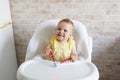 Baby eating at kitchen empty space table.Child`s nutrition Royalty Free Stock Photo