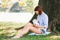 Mother breastfeeding newborn baby child on nature Royalty Free Stock Photo