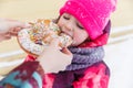 Baby eats bagel in park Royalty Free Stock Photo