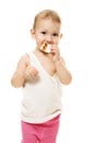 Baby eats candy on a white background