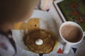 The baby eats pancakes with sour cream and cocoa. Royalty Free Stock Photo