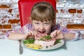 baby eats a steak Royalty Free Stock Photo