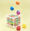 baby educational toy - a multi-colored cube. Development of fine motor skills and logical thinking. levitating pieces of