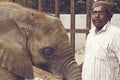 Baby elephant at Karachi Zoo with caretaker