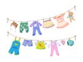 Baby fabric apparel. Baby girls and boys clothes hanging on clothesline. Drying children clothes and accessories after washing Royalty Free Stock Photo