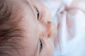 Baby face close-up, selective focus. Selective focus on the eyelashes. Royalty Free Stock Photo