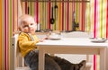 Baby family boy sit on toy kitchen Royalty Free Stock Photo
