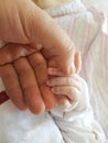 Baby and father hand hands holding each other Royalty Free Stock Photo