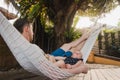 Baby and father are sleeping in a hammock Royalty Free Stock Photo