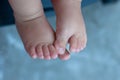 Baby feet on blue background Royalty Free Stock Photo