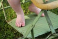 Baby feet closeup outdoors in antique stroller