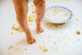 Baby feet dirty with food after lunch