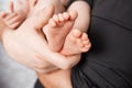 Baby feet in father hands. Dad and his child. Happy family concept. Beautiful conceptual image of Parenthood Royalty Free Stock Photo