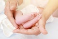 Baby feet in father`s hands. My father and his child. Happy Family concept. Beautiful conceptual image of fatherhood Royalty Free Stock Photo