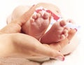 Baby feet in hands Royalty Free Stock Photo