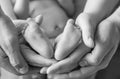 Baby feet in the hands of mom and dad Royalty Free Stock Photo