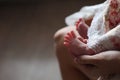 Baby feet in mommy's hands