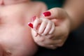 Baby feet in the mother hands. Family love concept. Newborn beauty.