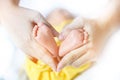 Baby feet in mother hands - hearth shape, Baby feet in mother hands. Mom and her Child. Happy Family concept. Beautiful conceptual Royalty Free Stock Photo