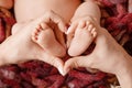 Baby feet in mother hands - hearth shape closeup. Mom and her Child. Happy Family concept. Beautiful conceptual image of Maternity Royalty Free Stock Photo