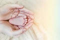 Baby feet in mother hands. Mom and her Child. Happy Family concept. Beautiful conceptual image of Maternity Royalty Free Stock Photo