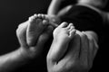 Baby feet in mother hands. Mom Child. Beautiful conceptual image of Maternity. Royalty Free Stock Photo