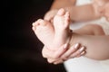 Baby feet in mother hands. Mom and her Child. Happy Family concept. Beautiful conceptual image of Maternity Royalty Free Stock Photo