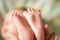 Baby feet in mother hands. Mom and her Child. Happy Family concept. Beautiful conceptual image of Maternity Royalty Free Stock Photo