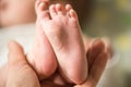 Baby feet in mother hands. Mom and her Child. Happy Family concept. Beautiful conceptual image of Maternity Royalty Free Stock Photo