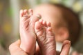 Baby feet in mother hands. Mom and her Child. Happy Family concept. Beautiful conceptual image of Maternity Royalty Free Stock Photo