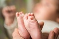 Baby feet in mother hands. Mom and her Child. Happy Family concept. Beautiful conceptual image of Maternity Royalty Free Stock Photo