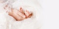 Baby feet in mother hands. Tiny newborn feet on female  hands closeup. Mom and her child. Happy family concept. Beautiful Royalty Free Stock Photo
