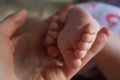 Baby feet in the mother`s hand Royalty Free Stock Photo