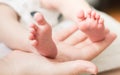 Baby feet on the mother's palm Royalty Free Stock Photo
