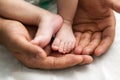 Baby feet in the palms of the father. Royalty Free Stock Photo