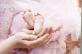 Baby feet in parents hands. Tiny Newborn Baby`s feet on parents shaped hands closeup. Parents and they Child. Happy Family concep Royalty Free Stock Photo