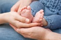 Baby feet in parents hands. Tiny Newborn Baby's feet Royalty Free Stock Photo