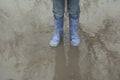 Baby feet in a puddle Royalty Free Stock Photo