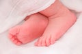 Baby feet sleeping in white bed Royalty Free Stock Photo