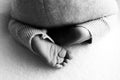 Baby feet. The tiny foot of a newborn in soft selective focus. Black and white image of the soles of the feet. Royalty Free Stock Photo