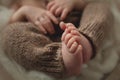 Baby feet. The tiny foot of a newborn in soft selective focus. Image of the soles of the feet. Royalty Free Stock Photo