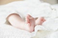 Baby feet on white coverlet. Toes Royalty Free Stock Photo
