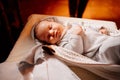 A baby fell asleep on a dressing table in a Church. the ordinance of baptism.