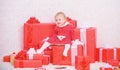 Baby first christmas once in lifetime event. Family holiday. Little baby girl play near pile of gift boxes. Gifts for Royalty Free Stock Photo