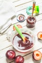 Baby food. Baby puree from fresh plum. Royalty Free Stock Photo