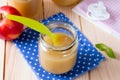 Baby food in bank and on a table Royalty Free Stock Photo