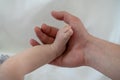 Father hand holding baby foot Royalty Free Stock Photo